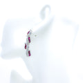Graceful Ruby Leaf Adorned Diamond Earrings