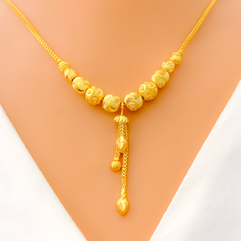 22k-gold-reflective-wavy-bead-hanging-chain-necklace