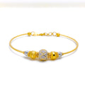 22k-gold-criss-cross-orb-bangle-bracelet